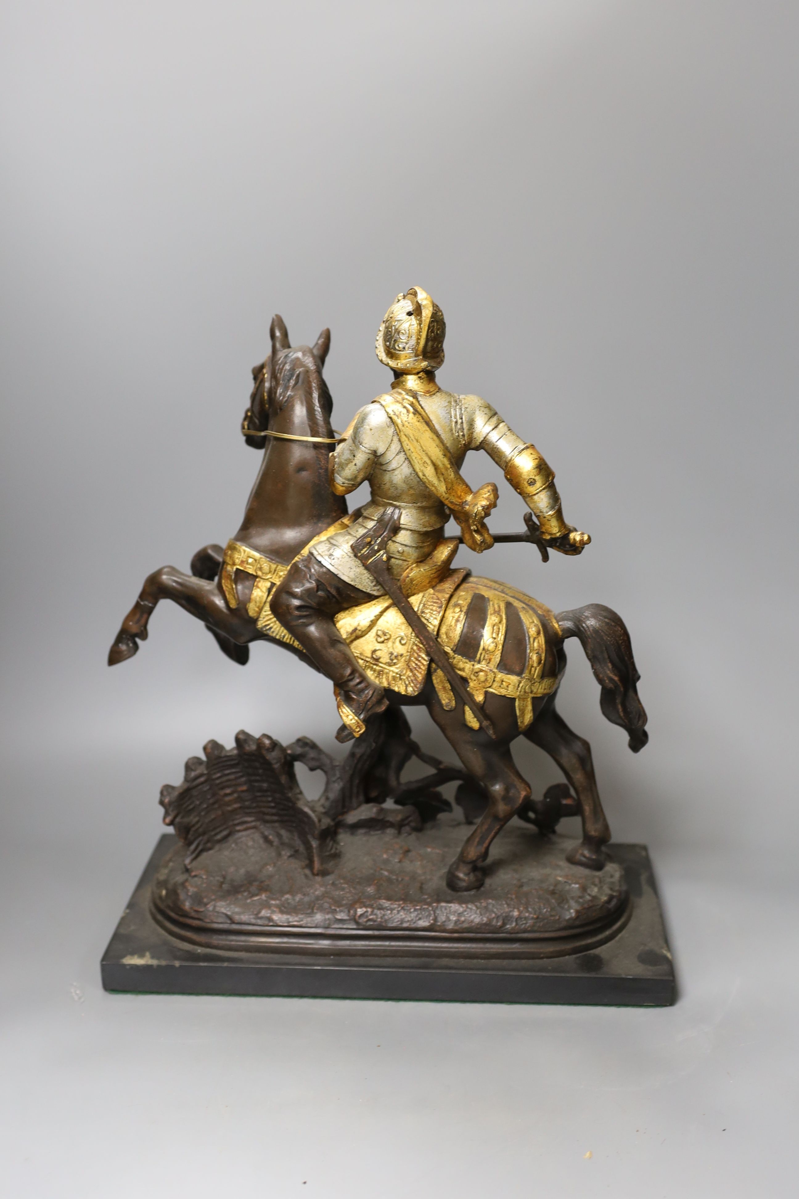 Three spelter warriors on horseback - tallest 43cm